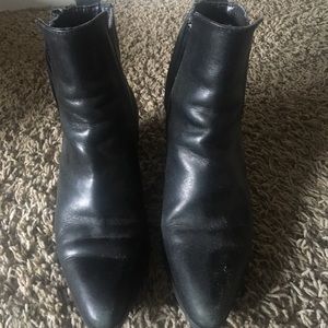 Black leather point toe Chelsea boots